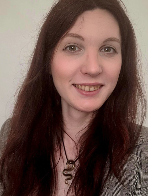 Victoria, brown hair, smiling at the camera